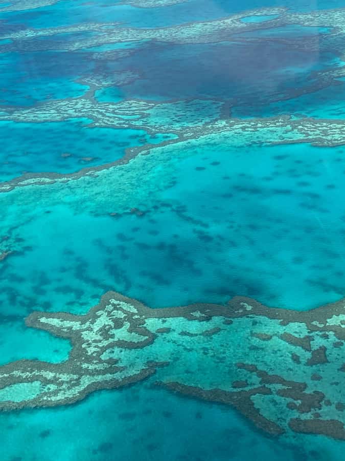 Airlie Beach: Whitsundays & Great Barrier Reef Scenic Flight - Heart Reef: getting that famous shape from a small aircraft