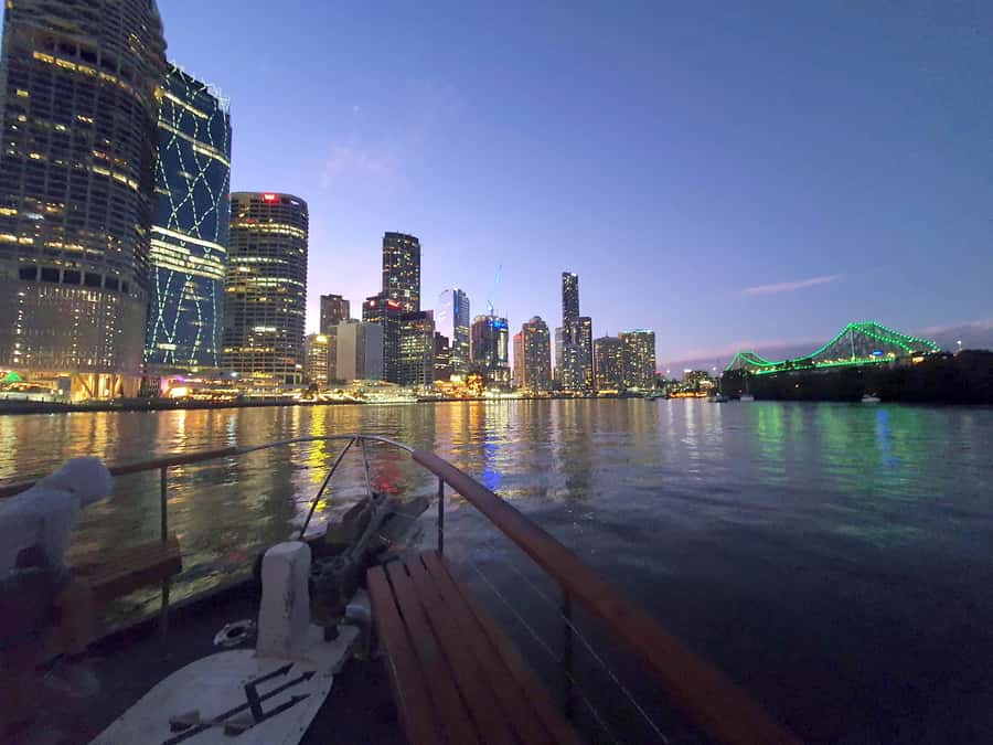 Brisbane: Sunset City Lights Cruise 5.30pm or 6pm <em>seasonal – Key highlights you should know’ /></p>
<ul>
<li><strong>Seasonal departure times</strong>: winter 5.30pm, summer 6pm, each designed around sunset into night lighting</li>
<li><strong>Story Bridge at night</strong>: you get a close-up view as the lights come on</li>
<li><strong>Kangaroo Cliffs on the route</strong>: expect a “wow” moment as part of the river scenery</li>
<li><strong>Included charcuterie share board</strong>: a ready-to-go snack that makes the cruise feel complete</li>
<li><strong>Onboard bar, licensed</strong>: buy drinks while you watch the skyline change colour</li>
<li><strong>No guided commentary</strong>: great for relaxation, not for bridge-by-bridge facts</li>
</ul>
<h2 id="why-this-sunset-to-city-lights-cruise-feels-so-good">Why this sunset-to-city-lights cruise feels so good</h2>
<p><img width="900" height="703" decoding="async" src=