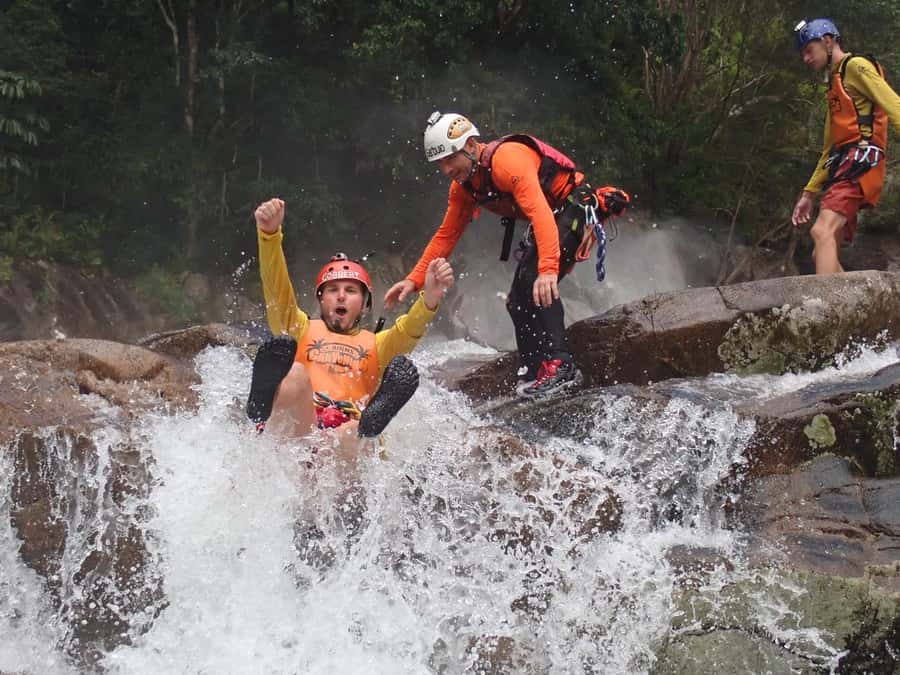 Cairns: Behana Gorge Rainforest Canyoning Tour - The Action Sequence: Abseils, Waterfalls, Rock Jumps, Slides, and Caves