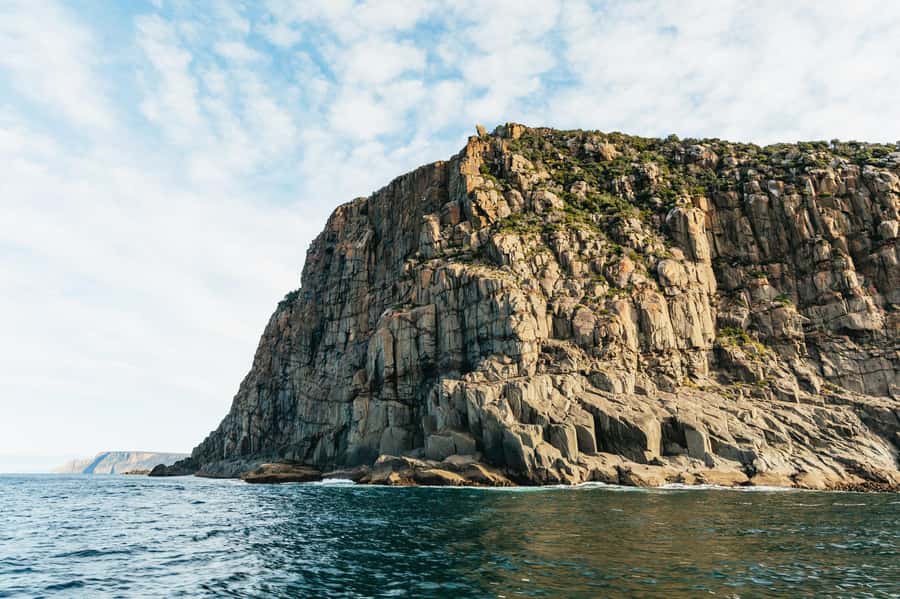 From Port Arthur: Tasman Island Wilderness Cruise - Tasman Island views, powered by open-air tiered seating