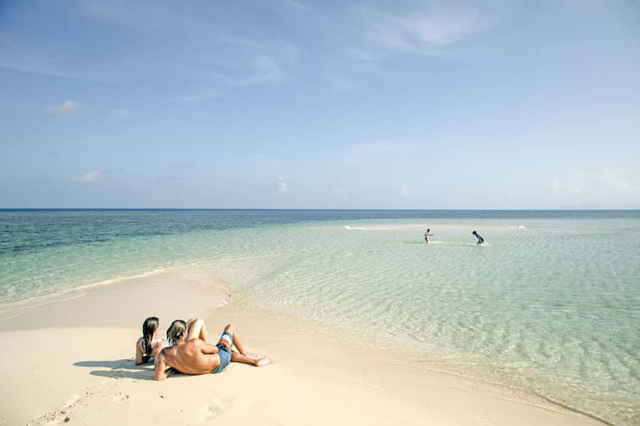 From Port Douglas: Outer Reef Cruise by Luxury Catamaran - Mackay Cay coral cay time: sand, turquoise water, and real breathing room