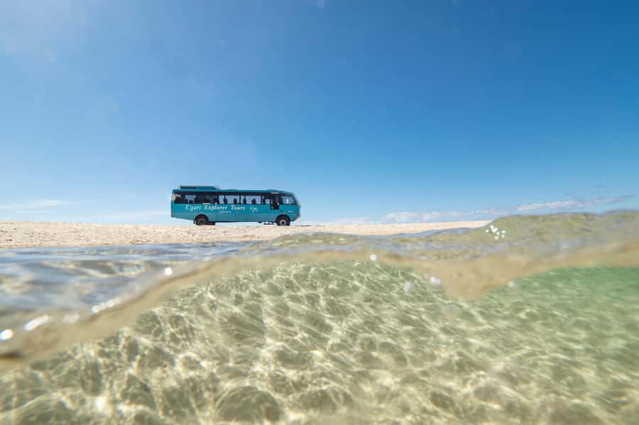 From Rainbow Beach: K'gari, Fraser Island Two-Day Coach Tour - Lake McKenzie: turquoise water, white silica sand, and real swim time