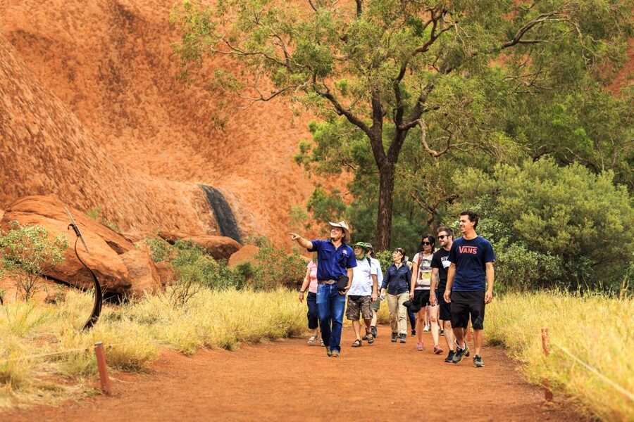 From Yulara: Uluru Tour and Sunset BBQ - What to bring for Uluru heat, short walks, and sunset shopping