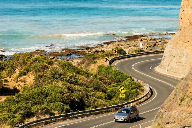 Full-Day Great Ocean Road and 12 Apostles Sunset Tour from Melbourne - Gibsons Steps and the coast run toward the Apostles