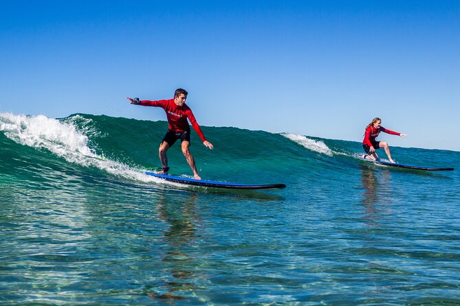 Learn to Surf at Broadbeach on the Gold Coast - Beginner boards, rash shirts, and wetsuits that match the season