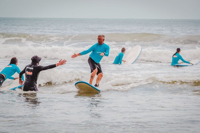 Learn to Surf at Noosa on the Sunshine Coast - The Beach Warm-Up: Safety Talk and Stand-Up Fundamentals