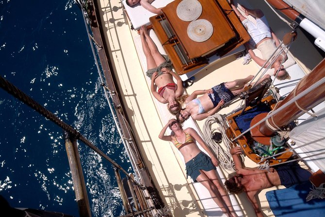 Providence Whitehaven Beach Sailing and Snorkeling Cruise - On board, you’re part of the action: steering time and real comfort limits