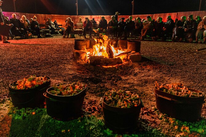 Starlights Cruise Experience - Camp dinner in the bush: stew, dessert, and bush poetry