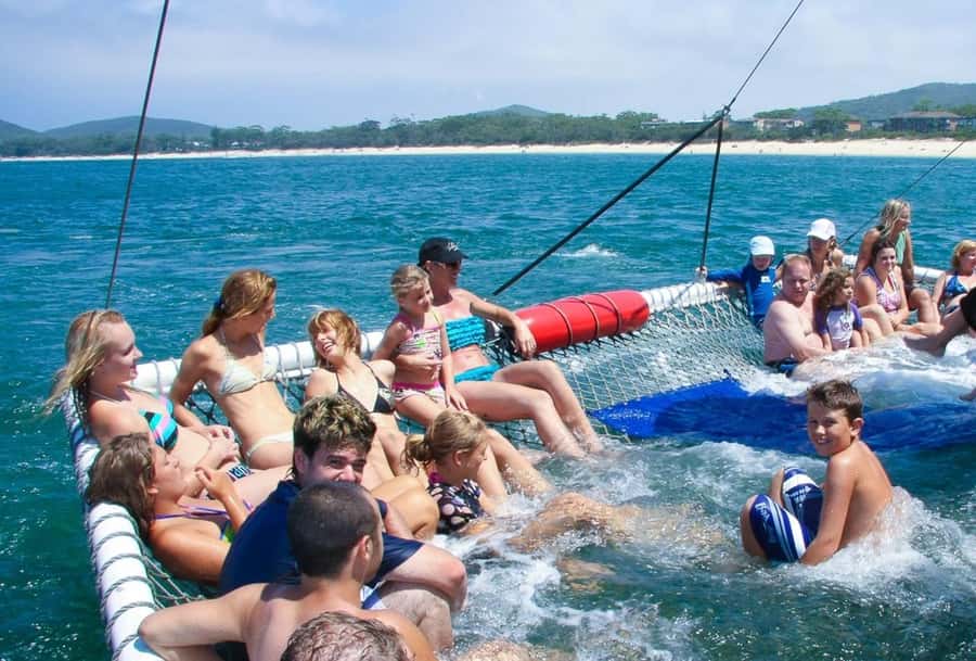Sydney: Port Stephens Dolphin Cruise & Sandboarding Day Trip - Stockton sand dunes, 4WD ride, and sandboarding on a huge mobile system