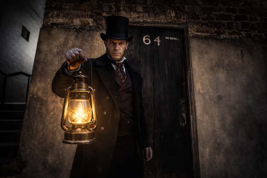 Sydney: Spirits of the Rock and Dark Past Walking Tour - The grim street story: mass burial pits, opium dens, and sly grog haunts